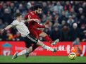Mo Salah mencetak gol kedua Liverpool pada laga melawan Manchester United di Anfield Stadium (Foto: Phil Noble/Reuters)