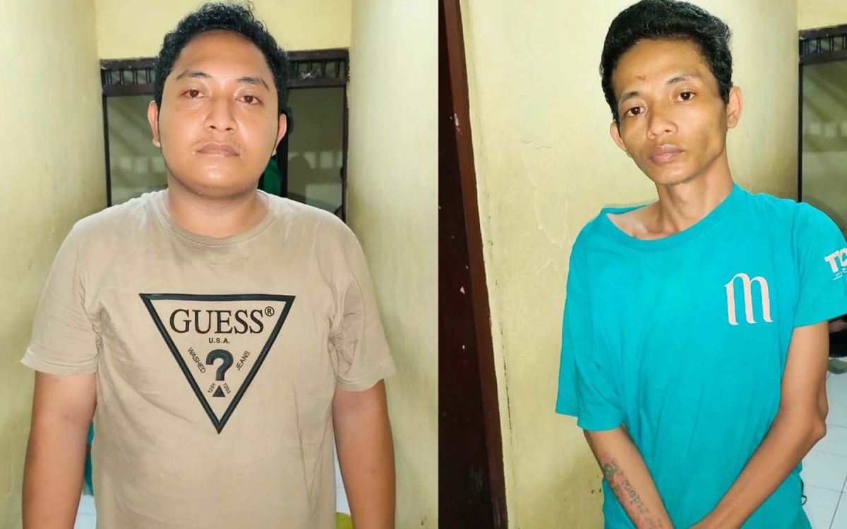 Dul (kiri), sang penipu ulung dan rekannya Zainal Arifin diamankan di Mapolsek Pabean Cantikan, Surabaya