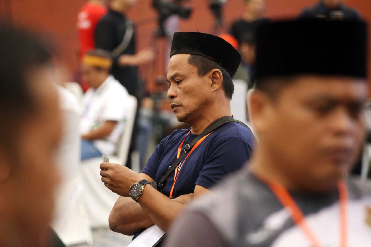 Peserta mengikuti Surabaya Domino Tournament 2026 di Grand City Convention Hall, Surabaya, Minggu (19/4/2026). (Foto: Ali Masduki/jatimnow.com)