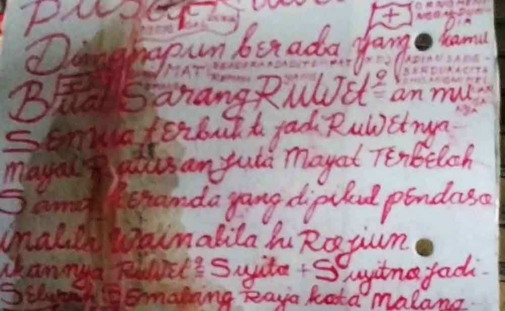 Tulisan tangan di sekitar mayat mutilasi di Malang